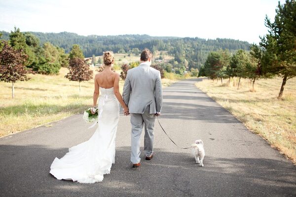Bunn Salarzon - bride and groom with dog walking
