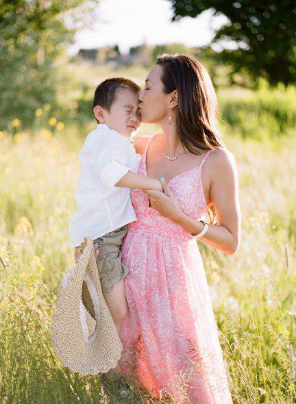 Bunn Salarzon - beautiful young mom kissing son on forehead