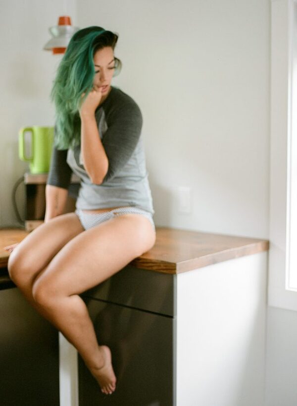 Bunn Salarzon - sexy woman sitting on kitchen counter