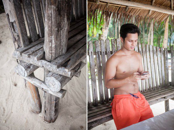 Bunn Salarzon - cute boy texting on phone at beach in philippines